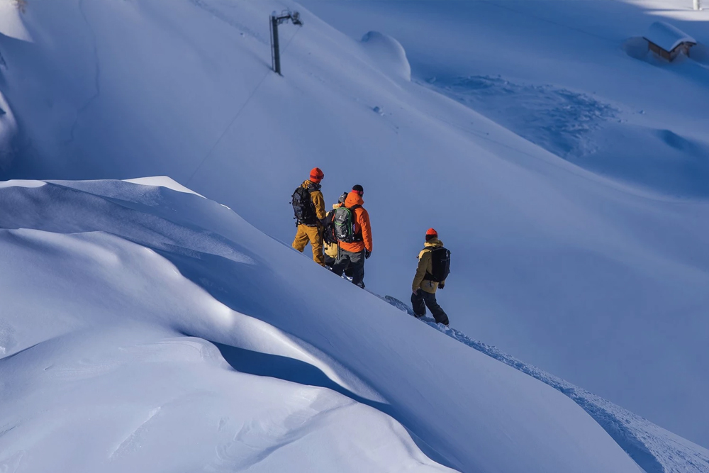 Group of Snowboarders on a snowy mountain