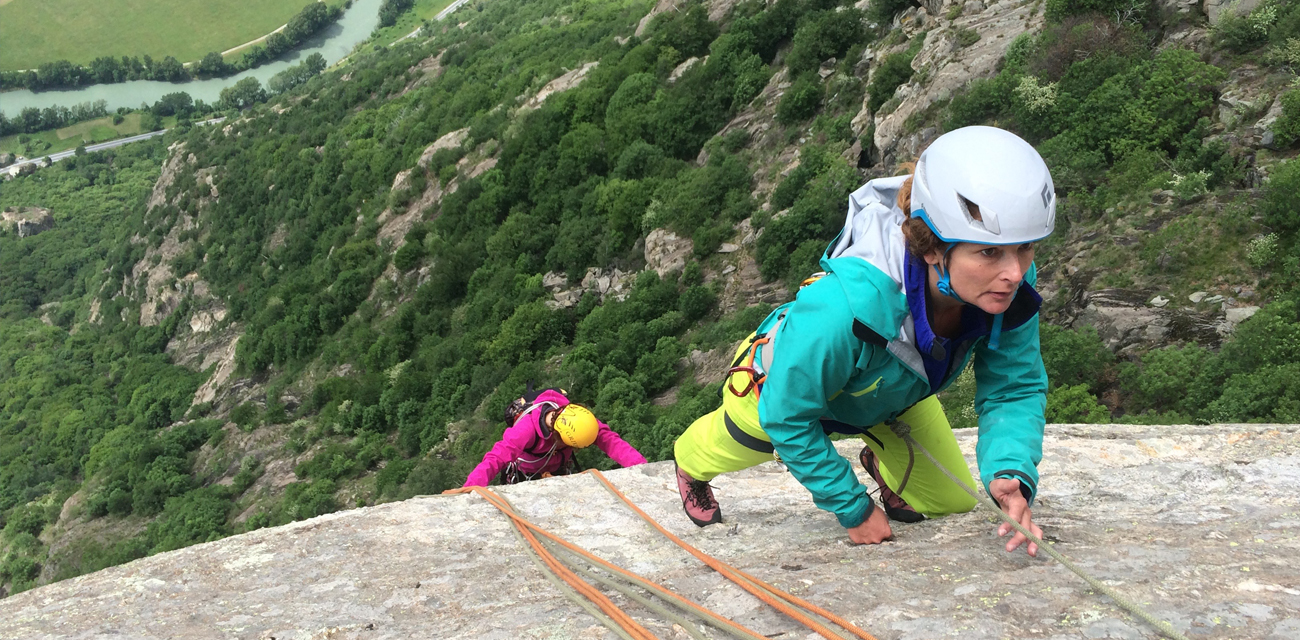 Two women climbing a long route